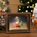 Dettaglio di una scatola luminosa natalizia con Babbo Natale ed effetto neve - Babbo Natale