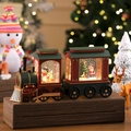 Detailed view of a vintage Christmas train music box with glowing scenes and Santa Claus - Classic Red Green Double Train