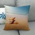 Linen beach cushion cover featuring shells and ocean scenery on a gray sofa - Beach Shell Starfish Style (4)