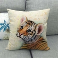 Detailed close-up of textured linen tiger pillow cover on a modern grey fabric sofa - Watercolor Style Little Tiger (6)