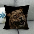 Detailed close-up of a roaring lion print on a square black linen pillowcase on sofa - Lion Roaring Expression (13)