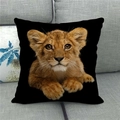 Detailed view of square black linen pillowcase with realistic lion cub print on a sofa - Realistic Lion Cub Image (11)