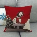 Detail of red linen pillowcase with a Dalmatian director print on a grey fabric sofa - Red Dalmatian Director Style (4)