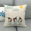 Linen pillowcase featuring cute cartoon penguins with ice cream on a gray sofa - Penguins and Ice Cream (9)