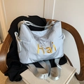Sac fourre-tout en nylon argenté avec broderie Hai dorée sur chaise, style minimaliste - Gris