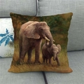 Linen decorative pillow cover with colorful elephant and calf print on a sofa - Elephant Mother and Child on Grass (10)