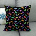 Close-up of square linen pillowcase with colorful dinosaur silhouettes on black background - 45x45cm / Black Multi-color Dinosaur Silhouette