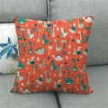 Close-up of linen fabric texture on orange cushion cover with cartoon dinosaur prints - 45x45cm / Orange Cartoon Dinosaur Tropical