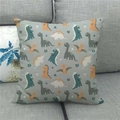 Detail of linen cushion cover featuring colorful cartoon dinosaurs on a gray sofa - 45x45cm / Light Gray Colorful Dinosaur Flower