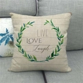Detailed close-up of linen pillowcase with green wreath and LIVE LOVE LAUGH text print - LIVE LOVE Laugh Green Leaves Wreath