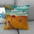 Close-up of linen cushion cover featuring oil painting style town illustration on a sofa - Girl with Balloon Fairytale (11)