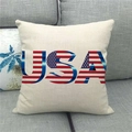 Close-up of linen pillowcase with USA flag letters on a modern grey fabric sofa - USA Word Art Flag Pattern (12)