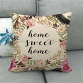 Detail of linen pillowcase with floral wreath and Home Sweet Home print on a grey sofa - 18x18 Inch / Home Sweet Home Floral Wreath Style