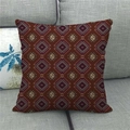 Detail of red geometric diamond pattern linen pillowcase on a grey sofa fabric - 45x45cm / Dark Red Ethnic Totem