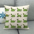 Linen cushion cover with green cartoon dinosaurs on a gray fabric sofa - 45x45cm / Beige Green Cartoon Dinosaur Decor