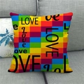 Rainbow LOVE linen pillow cover on a grey sofa, perfect for Valentine's Day decor - Rainbow Patchwork LOVE Style (12)