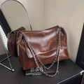 Retro dark brown pleated leather shoulder bag with silver chain strap and flap closure - Brown