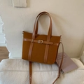Brown corduroy tote bag with leather trim and adjustable shoulder strap for casual style - Brown