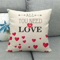 Macro view of linen cushion cover with All You Need Is Love text and red hearts - Typography Heart Style (10)