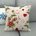 Close-up of linen pillowcase with red roses and heart patterns on a gray sofa - Vintage Rose Script Style (13)