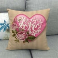 Close-up of linen pillowcase featuring a pink heart, love script, and roses on sofa - Pink Rose LOVE Style (18)