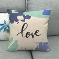 Close-up of linen cushion cover with blue abstract art and cursive love text - 45x45cm / Abstract Block love Style