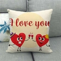 Close-up of linen pillow cover with I Love You heart characters on a grey sofa - 45x45cm / Celebrating Heart Characters Style