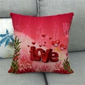 Detail of red Valentine linen pillowcase with 3D Love text and hearts on a grey sofa - 3D Red Heart Love (6)