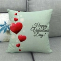 Close-up of linen pillowcase with red hearts and Happy Valentine's Day text on sofa - 45x45cm / Light Green Happy Valentine's Day Style
