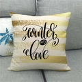 Close-up of a linen pillowcase featuring Winter AND Love text on a modern grey sofa - 45x45cm / Yellow White Stripe Winter AND Love Style
