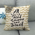 Close-up of linen pillow cover with All you need is love and Beach text and sea patterns - Beach Ocean Style (13)