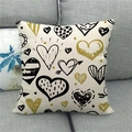 Linen blend throw pillow cover with golden and black heart patterns on grey sofa - Geometric Hand-drawn Hearts(6)