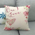 Detail of linen Valentine's pillowcase with 'One Love' print on a grey sofa fabric - Romantic Floral Heart Ribbon Style (11)