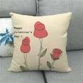 Linen Valentine's Day pillowcase with red roses and text on a grey fabric sofa - Red Roses Style (1)