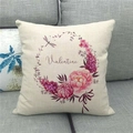 Close-up of linen pillowcase with floral Valentine heart print on grey sofa - Pink Peony Dragonfly Wreath Style (13)