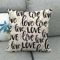 Close-up of linen love print pillow cover displayed on a modern grey fabric sofa - Artistic Love Combination(18)
