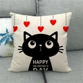 Detail of linen Valentine's Day pillowcase with black cat and red hearts on a gray sofa - Five Hearts Black Cat Style (12)