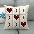 Close-up of linen pillowcase with Valentine Tic-Tac-Toe print on gray sofa - Tic-Tac-Toe Plaid Heart (9)