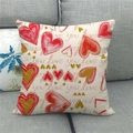 Detail of linen pillowcase with red hearts and love print on a gray fabric sofa - Red Gradient Heart Mix (16)