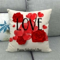 Valentine's Day linen pillow cover with red roses, hearts, and LOVE text on a grey sofa - 45x45cm / LOVE Rose Style (1)