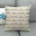 Close-up of linen pillowcase featuring a minimalist black cursive Love design - 45x45cm / Minimalist Handwritten love Style (8)