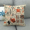 Close-up of linen pillowcase with vintage Valentine patterns on a grey sofa - 45x45cm / Retro Cupid Style (11)