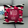 Linen cushion cover with zebra pattern, red hearts and Wild at Heart text on a sofa - 45x45cm / Heart Balloon Style (19)