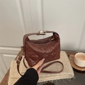 Brown heart-quilted leather tote bag with gold hardware and adjustable crossbody strap - Brown