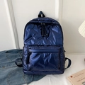 Navy blue quilted puffer backpack for women featuring large capacity and sleek double zippers - Blue