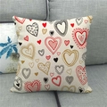 Detail of linen pillowcase with heart patterns on a grey fabric sofa for home decor - All-over Red Heart Texture Style (1) / 45x45cm