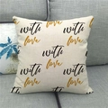 Close-up of linen pillowcase with with love gold glitter print on a gray fabric sofa - With Love Gold Glitter Art Style (6)