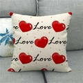 Close-up of linen Valentine's pillowcase with red heart and Love print on a gray sofa - Big Red Heart Handwritten Love Style (9)