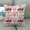Linen pillow cover with pink hearts and LOVE print on a gray fabric sofa - Pink Heart Collage Style (11)