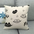 Close-up of linen cushion cover showing XO print and fabric texture on a gray sofa - Modern XO Art Style (14)